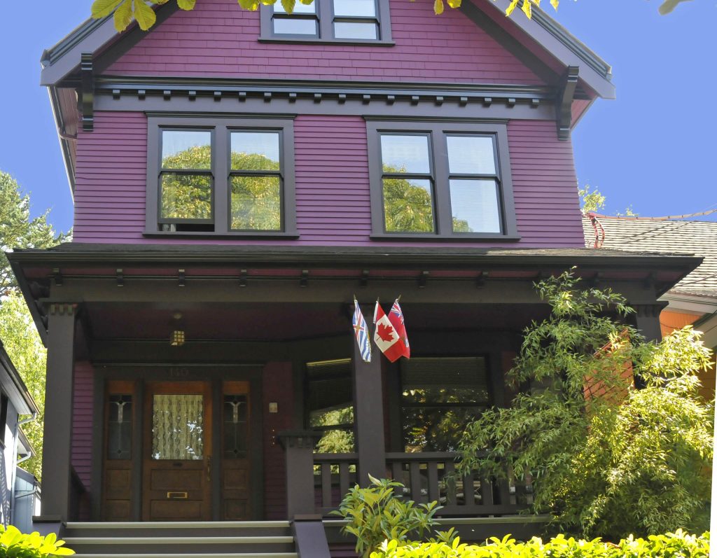 Light Lavender Home Siding With Black Windows