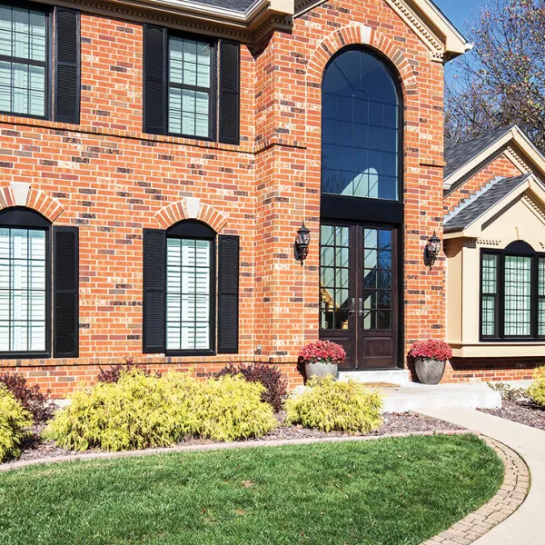 Rich Copper Hues For Home Exteriors With Black Window Frames