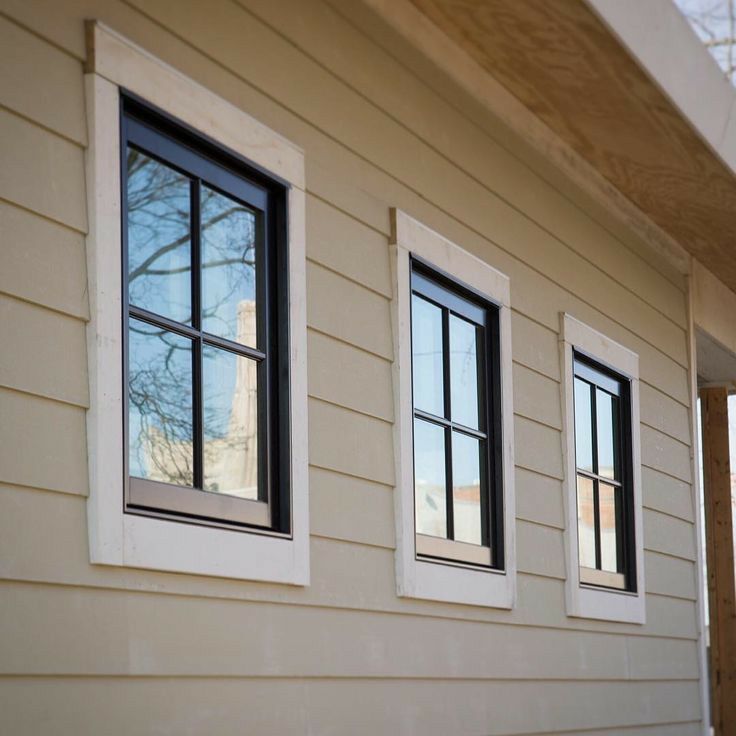 Soft Beige for Home Exteriors With Black Windows